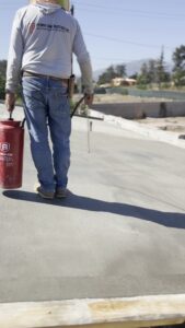 Applying curing compound to the new deck at 2611 Marengo, Altadena