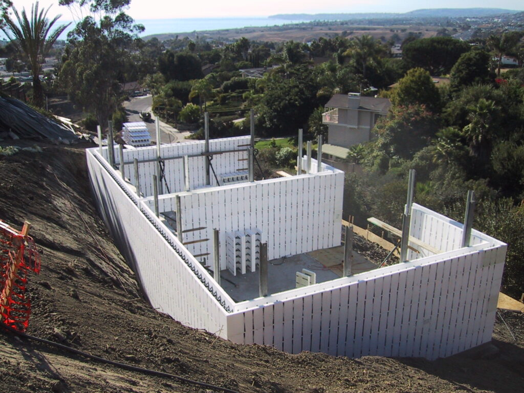 Tall braced ICF basement walls on a hillside at the Proctor project