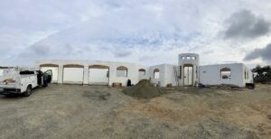 Full ICF shell of the Koll custom home with arched openings and round entry tower