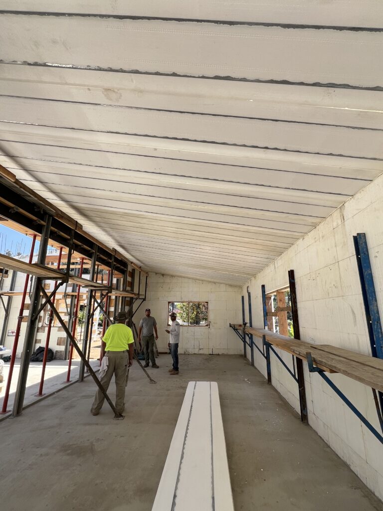 Underside of an Insuldeck concrete roof deck over ICF walls